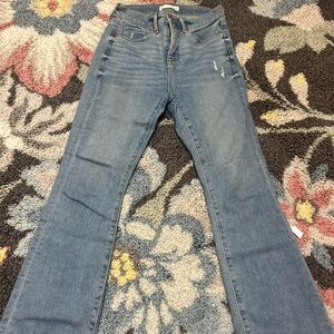 Loft petite size 0 light wash boot cut jeans with distressed detailing
